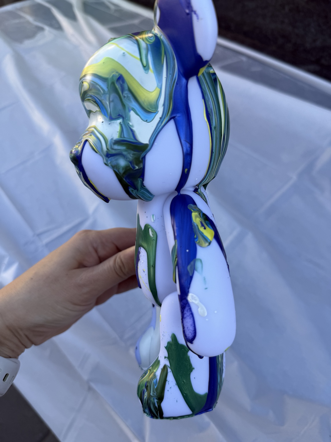 Blue and green painted bear